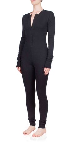 Stay warm and cozy this season in the ETERNE Thermal Long John. Crafted from a lightweight cotton and modal blend, this cozy season must-have item is designed for a close fit with its henley inspired neckline and ultra soft waffle knit fabric. Enjoy a comfortable winter wearing this stylish onesie. Details: Color: Black 48% cotton, 48% modal, 4% spandex Waffle knit fabric Button front closure Vendor Code: CBBR408-04 Fits true to size, intended for a close fit Model is 5ft 5in and is wearing a size S Fall Waffle Knit Henley For Loungewear, Fitted Long Sleeve Henley For Fall, Relaxed Fit Henley For Fall Loungewear, Fitted Long Sleeve Ribbed Henley, Ribbed Long Sleeve Henley For Winter, Winter Ribbed Long Sleeve Henley, Winter Long Sleeve Ribbed Henley, Fall Ribbed Henley For Loungewear, Long John