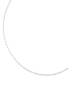 This delicate silver chain is perfect for layering on charms. Adjustable length clasp allows the necklace to be worn up to 19" in length. Lobster clasp closure. Silver Cable Chain Jewelry For Layering, Sterling Silver Delicate Chain Necklace Paperclip Shape, Sterling Silver Delicate Paperclip Chain Necklace, Silver Paperclip Chain Necklace For Layering, Minimalist Choker Chain Necklace With Lobster Clasp, Dainty Silver Chain Necklace For Layering, Silver Cable Chain Link Necklace, White Link Necklace With Silver Chain, Silver Chain Necklace With Adjustable Chain For Layering