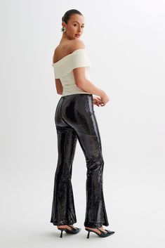 Zero disco ball required.The WILMA are a pair of sparkling wide-legged pants with a high waistline and flared hems. An invisible zipper closure at the side seam gives it a sleek, seamless silhouette. The legs transition into a flattering bootcut that complements its high, fitted waist. Lined sequinned fabrication adds a touch of comfortable glam, making these pants the perfect choice for all-night wear. Black Sequin Pants, Sequin Pants, Night Wear, Disco Ball, Black Bodysuit, Invisible Zipper, Black Heels, Nightwear, Black Pants