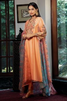 Peach asymmetric kurta with floral printed side panel embellished by sequins and swirl thread embroidery. Comes with dhoti pant and a printed dupatta. - Aza Fashions Embroidered Orange Palazzo Set, Orange Traditional Wear With Dabka Work, Transitional Multicolor Embroidered Anarkali Set, Navratri Dupatta With Dabka Detail, Multicolor Embroidered Palazzo Set, Multicolor Dabka Sharara, Eid Festival Sets In Traditional Drape, Multicolor Embroidered Salwar Kameez With Dabka, Salwar Kameez With Multicolor Embroidery And Dabka