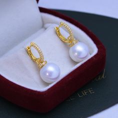 White 11-12mm Freshwater Pearl Earrings This popular earrings design features AAAA quality, round freshwater pearls measuring 11-12mm. Material: Freshwater Pearl with 925 sterling silver or gold vermeil Vermeil (noun)"ver·may"A unique blend of high-quality, precious metal, without the hefty price tag. Unlike regular gold plating, a thick layer of 18ct gold is layered on top of a sterling silver base. Put simply, gold-plated vermeil gives you the best quality for the best price. And you would lov Fine Jewelry Pearl Drop Hoop Earrings, Fine Jewelry Round Hoop Earrings With Pearl Drop, White Gold Huggie Earrings With Pearl Drop, Classic Round Pearl Huggie Earrings, Fine Jewelry Gold Plated Round Pearl Earrings, Gold Plated Round Pearl Earrings Fine Jewelry, Luxury Pearl Drop Round Hoop Earrings, White Round Huggie Earrings With Pearl Drop, Luxury Round Hoop Earrings With Pearl Drop