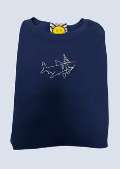 a blue t - shirt with an airplane drawn on it