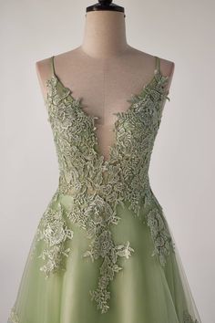 This Sage green dress plays up your femininity with romantic lace appliques, a fitted bodice, and breathtaking details like spaghetti straps, a plunge neck with mesh insert, and a full-length lace-up back. It checks all the boxes with its comfy tulle material and built-in bra. Perfect for when you need to look polished without taking yourself too seriously! Green Lace Dress With Fitted Bodice, Green Lace Dress For Prom Season, Green Lace Dress For Prom, Green Prom Dress With Lace-up Back, Green Evening Dress With Corset Back For Gala, Green Sleeveless Evening Dress With Corset Back, Green Evening Dress With Sheer Bodice For Prom, Green Floor-length Evening Dress With Lace Bodice, Green Dress With Lace Bodice And Fitted Bodice