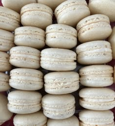 a bunch of white macaroons stacked on top of each other