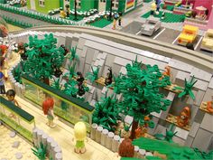 there are many legos on display in this toy store, including trees and people