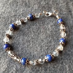 Genuine Lapis Lazuli Beads With Crystal And Handmade Sterling Silver (.925) Beads. Gorgeous Blues And Sparkling Crystals. Never Worn! New! Approximately 8 Inches Long, Size Can Be Adjusted. Don't Forget To Bundle Your Likes And Save On Shipping. Handmade Sterling Silver Healing Bracelet, Elegant Blue Jewelry With Silver Beads, Sterling Silver Crystal Bracelet With Round Gemstone Beads, Blue Sterling Silver Beaded Bracelets As Gift, Elegant Sterling Silver Healing Bracelet, Sterling Silver Jewelry With Polished Blue Beads, Handmade Blue Sterling Silver Beaded Bracelets, Elegant Sterling Silver Crystal Bracelet With Gemstone Beads, Adjustable Blue Sterling Silver Bracelet With Silver Beads