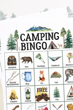 the camping bingo game is shown with animals, tents and campfires on it