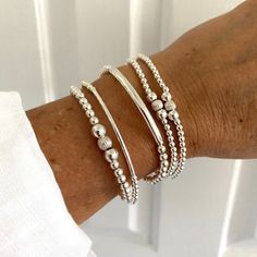 This sterling silver bead bracelet is a timeless piece of women jewelry gift. This silver stacked stretchy bracelet set is a lovely wedding jewelry as a gift for bridesmaids .Don't forget to gift  yourself ,you always deserve it ! KEY FEATURES :  * Highest-quality Sterling Silver   * 3mm or 4mm Beads   * Sterling silver Tubes   * Durable 1mm stretchy cord   * All  items feature a gift box and cleaning cloth  ⭐️  YOU CAN ORDER ONE BY ONE OR IN SETS  PROCESSING TIME :    * All our pieces are handm Bracelet Set Silver, Sterling Silver Bead Bracelet, Silver Bracelets For Women, Silver Bead Bracelet, Miami Fl, Sterling Silver Bead, Bracelet Stack, Stretch Bracelet, Bracelet Gift