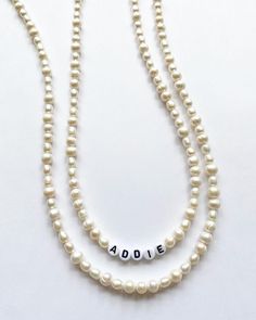 FREE SHIPPING You will receive 1 freshwater pearl necklace like photos. Can put a name/word in the center or just continue freshwater pearl pattern. Please leave a note in the personalization box about your choice. Freshwater pearls may differ in size and shape due to natural variation, and clasp shape may differ as well. *Skull necklace also available in my shop. Beaded Pearl Jewelry For Birthday, Everyday Handmade Pearl Beaded Necklaces, Adjustable Pearl Necklace With Letter Beads, Pearl Necklace With Letter Beads And Round Beads, Personalized Pearl Necklaces With Round Beads, Pearl Jewelry With Letter Beads, Personalized Pearl Necklace With Round Beads, Pearl Jewelry With Round Letter Beads, Pearl Beaded Necklaces With Letter Beads