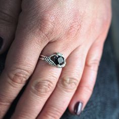 Claddagh Ring Heart Gem Sterling Silver Gothic Skull Engagement Ring◆ The Claddagh ring has centuries of history, but today it symbolizes three things: friendship, loyalty and love. A beautiful small women ring with black heart zircon on the top. Two skeleton hands hold the black heart from different sides. Perfect fit for engagement or wedding in gothic style occasion. Simple design make it very comfortable and convenient for wearing everyday. We did blacked oxidation on the top and black zirco Anniversary Spiritual Skull Ring, Gothic Open Ring For Anniversary, Gothic Open Ring Jewelry For Gift, Adjustable Gothic Style Rings For Anniversary, Gothic Style Jewelry Metal Ring As Gift, Gothic Heart-shaped Wedding Jewelry, Elegant Sterling Silver Skull Ring With Gemstone, Gothic Open Ring Jewelry For Anniversary, Gothic Style Ring Jewelry Gift