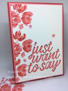 a card with pink flowers and the words just want to say written in white ink