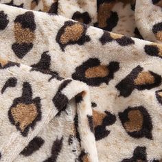 a close up of a leopard print blanket