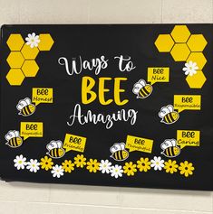 a black and yellow bulletin board with bees on it that says ways to bee amazing