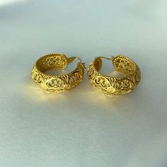 Introducing our exquisite Filigree Design Hoop Earrings, a true embodiment of elegance and craftsmanship. Specifications: Length: 30 mm | 1.2 inch Extension: 0 mm | 0.0 inch Width: 10 mm | 0.4 inch Weight: 16 grams Handmade Elegant Hoop Huggie Earrings, Elegant Handmade Hoop Huggie Earrings, Elegant Handmade Huggie Hoop Earrings, Gold Earrings With Intricate Design For Anniversary, Filigree Round Hoop Earrings For Wedding, Gold Plated Hoop Earrings For Wedding, Anniversary Gold Huggie Earrings Pierced, Luxury Engraved Gold Earrings, Small Hoop Gold Plated Earrings For Wedding