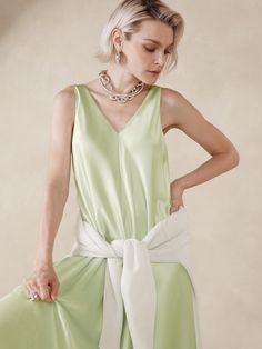 This floaty midi dress is cut with inset godet panels to increase the sweep of its skirt.  For fabric, we selected our signature silk charmeuse, a fabric we love for its beautiful drape, satin-like shine, and ease of care.  Trapeze Fit: Cut for a flowing, A-line fit.  No waist definition.  Scoop neck.  Scoop back.  Fully lined.  Trapeze Fit: Cut for a flowing, A-line fit.  No waist definition.  Sleeveless.  Midi length.  Model: Size S, 5'10" (178cm). Chic A-line Silk Satin Dress, Spring A-line Midi Dress With Bias Cut, Satin A-line Silk Dress, Silk Maxi Dress With Satin Finish And V-neck, Flowy Silk A-line Midi Dress, Chic Silk Dress Made Of Viscose, Chic Silk Maxi Dress For Daywear, Chic Sleeveless Silk Crepe Dress, Summer A-line Satin Silk Dress