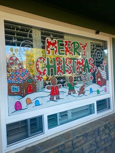 a christmas window with gingerbreads and candy on it