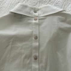 Jones & Co. White Blouse Tunic. Size Small. Sleeves Can Be Buttoned To Elbow. Very Versatile. Buttons Run Down Back. New Without Tags! Summer Formal Blouse With Spread Collar, Formal Summer Blouse With Spread Collar, Formal Spread Collar Blouse For Summer, Office Tops With Peter Pan Collar And Buttons, Chic Tops With Peter Pan Collar For Work, Workwear Tops With Peter Pan Collar And Button Closure, Peter Pan Collar Tops With Buttons For Office, Chic Peter Pan Collar Tops For Work, White Collared Shirt For Daywear