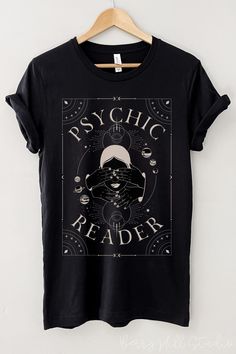 Psychic Lover, Psychic Reader Graphic Tee in Black  Feels soft and lightweight, with the right amount of stretch, and It's comfortable and flattering. All inks used to print are high quality, water-based and eco-friendly. This T-shirt is unisex sizing - it is larger than your typical woman's t-shirts. Please use the sizing guide for best fit - you can use your own T-shirt to compare measurements: see the sizing chart provided in product photos. Fabrication Solid Colours - 100% Airlume combed and Spiritual Shirt Ideas, Tarot Shirt Design, Witchy Shirt Design, Witch Tshirt Ideas, Aesthetic Tshirt Design, Witchy Tshirt, Motivational Shirts, Clothes Print, Goth Christmas