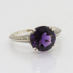 Vintage Sterling Silver Round cut Amethyst Ring...Marked 925...Total of weights 2.5grams... Size 9...Measure of stone 10MM...It's in very good condition. Heirloom Solitaire Purple Amethyst Ring, Classic Purple Gemstone Birthstone Ring, Classic Purple Birthstone Ring With Center Stone, Classic Purple Birthstone Ring With Gemstone, Classic Amethyst Purple Rings, Classic Purple Birthstone Ring, Classic Purple Amethyst Ring Round Cut, Classic Purple Amethyst Round Cut Ring, Classic Amethyst Birthstone Ring