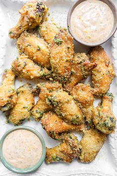 fried chicken wings with dipping sauce on the side