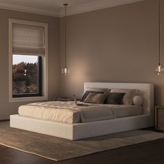 a bedroom with a large bed and two lamps on either side of the window sill