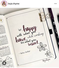 an open planner with the words happy written on it