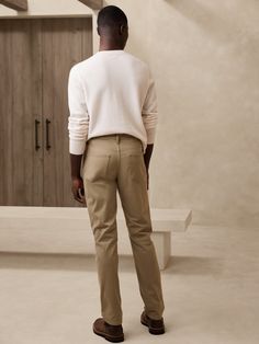 We updated our best-selling Traveler pant, keeping the same high-stretch comfort, but adding a more pronounced twill texture to the fabric.  Slim fit: Mid-rise.  Slim leg.  14" leg opening.  Organic: Made with certified, organically grown cotton that's easier on the earth.  Fabric from Italy's Olimpias mill.  Zip fly with button closure.  Belt loops.  Five-pocket styling.  Slim fit: Mid-rise.  Slim leg.  Leg opening: 14" Inseams: Short 30", Regular 32", Long 34" Model: Size 32x32, 6'2" (188cm). Earth Fabric, Travel Pants, Navy And Khaki, Dark Olive Green, Blue Khakis, Slim Leg, Slim Legs, The Earth, Charcoal Grey