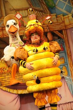 there is a man dressed as a bee and chicken