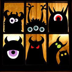 the silhouettes of monster heads are shown in front of a window