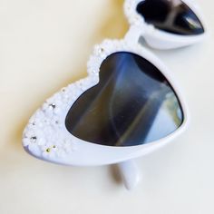 Look stunning on your wedding day in these amazing floral heart shaped sunglasses. These glasses are perfect for the person that loves white, rhinestones and pearls to wear at a garden party, bachelorette party wedding or bridal shower. These will look stunning in engagement photos or wedding photos. Not getting married? These are perfect to complete your music festival or concert look. Pair with your favorite summer dress. Each pair is hand embellished with the cutest miniature flowers and the Garden Party Bachelorette, Concert Look, Miniature Flowers, Rhinestone Sunglasses, Shaped Sunglasses, Heart Shaped Sunglasses, Concert Looks, Floral Heart, Party Bachelorette