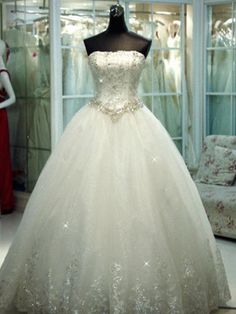 a wedding dress on display in a store