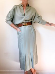 90s vintage sage dolman sleeve dress / wide relaxed button up top / pencil bottom with pleats at front / angled pockets / elastic waist / rayon blend / made by Meridian ⚡️ labeled size 4 (modeled on size small, 5'5") ⚡️ measured lying flat: shoulders 24" pit to pit 22" waist 10"-16" hips 18" length 51" sleeve length 17.5" ⚡️missing original belt (belt pictured also for sale), two very small marks on left chest (pictured) ------------------------------------------------------------------------------------------- Please message questions prior to purchase. Once shipped, sales are final, no return/exchange. But please contact me if you have any problems with your order. Please see FAQs for more information on shop policies. Thanks! Dolman Sleeve Dress, Button Up Top, 90s Vintage, Dress Clothes For Women, Dolman Sleeve, Label Sizes, Waist Size, Sleeve Dress, Crayon