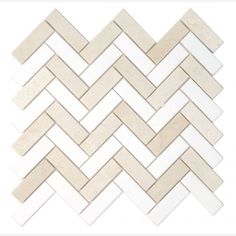 a white and beige herringle tile pattern