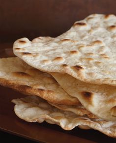 several flat breads stacked on top of each other