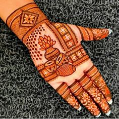 henna tattoo on the palm of someone's hand