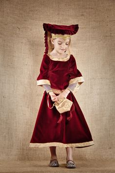 A princess costume to create a lifelike and gorgeous Medieval Princess Alienor - SIZE 8 yo The costume is composed with 4 different pieces 1 - The dress is made with a beautiful burgundy cotton velvet.  The half sleeves are made in violet linen. The neckline, the sleeve cuffs and the bottom of the dress are made with a gold taffetas Jacquard The lacing is on the back   2 - The belt in covered with a large braid trimming and has 2 ornamented metal buttons. The belt is adjustable thanks to elastic Red Princess Costume For Costume Party, Red Princess Costume For Fancy Dress, Princess Historical Dress For Costume Party, Medieval Pattern, Medieval Princess, Princess Costume, Cotton Velvet, A Princess, Historical Fashion