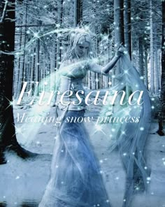 a woman in a blue dress is walking through the woods with snowflakes on her head