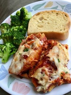 a white plate topped with lasagna and broccoli