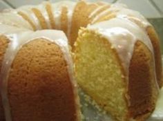 a bundt cake with white icing on a plate