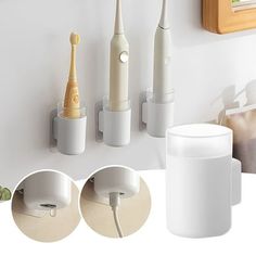 three electric toothbrushes are plugged into the wall