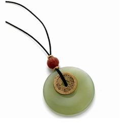 "This pendant features genuine jade and carnelian, with an antique reproduction brass I-Ch'ing coin. The pendant hangs on a waxed cotton cord. There is a knot closure at the top with a brass bead. Necklace measures 17\" long from the top of the cord to the bottom of the jade disc" Adjustable Vintage Jade Necklace, Adjustable Vintage Jade Necklaces, Vintage Adjustable Jade Necklaces, Vintage Adjustable Jade Necklace, Adjustable Jade Necklace For Good Luck, Vintage Waxed Cord Jewelry For Gifts, I Ching, Carnelian Pendant, Newport Ri