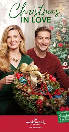 a man and woman holding a christmas basket