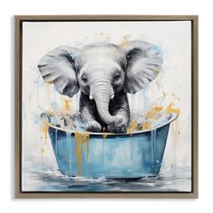 an elephant in a blue bathtub with yellow paint splatters