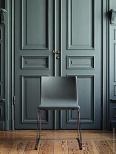 a chair sitting in front of a door with the word interest on it's side