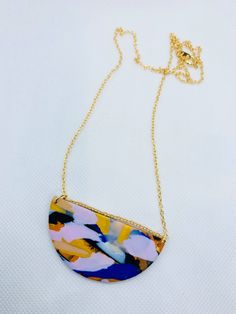 Handmade polymer clay necklace. Fixtures: 22ct gold-plated brass chain. Dimensions: chain length is 22 cm, pendant is 6 cm wide and 3 cm long. Multicolor Necklaces With Gold Chain For Gift, Unique Gold Polymer Clay Necklace, Gold Hand-painted Round Pendant Necklace, Gold Polymer Clay Pendant Necklace, Gold Pendant Necklace In Polymer Clay, Shrinking Violet, Gold Statement Necklace, Polymer Clay Necklace, Clay Necklace