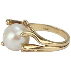 Modernist Gold and Baroque Pearl Cocktail Ring | See more rare vintage Cocktail Rings at https://www.1stdibs.com/jewelry/rings/cocktail-rings Pearl Cocktail Ring, Pearl Rings Vintage, Gold Pearl Ring, Gold Baroque, Vintage Cocktail Ring, Pearl Necklace Designs, Gold And Silver Rings, Dress Rings, Pearl Size