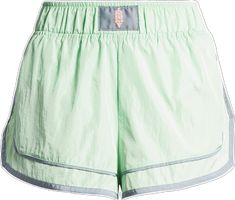 a pair of green shorts with silver trims