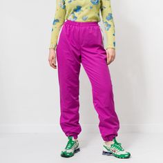 "Vintage 90's track pants in raspberry-pink with printed graphic on the left leg - elastic waist - lined - materials: no tag SIZE size from the tag: no tag best fits women: L MEASUREMENTS waist: 27-38.5 inches (68-98 cm) hips: 43.5 inches (110 cm) rise: 14.5 inches (37 cm) length: 42 inches (107 cm) inseam: 31 inches (79 cm) The model is 5'9\" (174 cm), measures 35-27-38 (90-69-96 cm) and typically wears clothing in size M CONDITION - 9/10 - the pants in great pre-owned vintage condition. Washed. Ready to wear." Purple Sweatpants For Spring Streetwear, Pink Sportswear Tracksuit For Sports, Pink Sportswear Tracksuit For Jogging, Pink Sportswear Tracksuit, Pink Tracksuit For Sports In Spring, Pink Spring Tracksuit For Sports, Casual Pink Sweatpants For Jogging, Pink Cotton Tracksuit For Streetwear, Pink Pants With Elastic Waistband For Streetwear