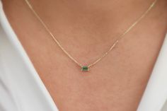 This necklace is made out of 14k solid gold with a stunning Genuine Natural green Emerald in the form of a baguette to give you a modern and mesmerizing look. The chain is adjustable in length, which makes it look lovely with any outfit. You will receive a certificate with the necklace.  Please keep into account that we use Natural Emerald, so there can be slight changes in color and cut. This makes each stone unique and one of a kind.  💎Design: Emerald Necklace 💎 Material: Solid 14k Gold and Emerald Baguette Necklace, Luxury Gold Baguette Cut Emerald Necklace, Small Emerald Necklace, 14k Gold Jewelry With Green Baguette Diamonds, Green 14k Gold Jewelry With Baguette Diamonds, Gift Fine Jewelry Emerald Necklace With Baguette Diamonds, Baguette Cut Emerald Necklace Gift, Emerald Baguette Cut Necklace For Gift, Baguette Necklace