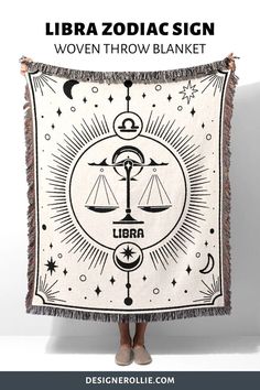 the libra zodiac sign woven throw blanket is shown in black and white with stars